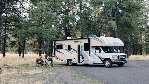 WHITE RV RESTING CAMP IN THE WOODS -RISK COVERAGE INSURANCE